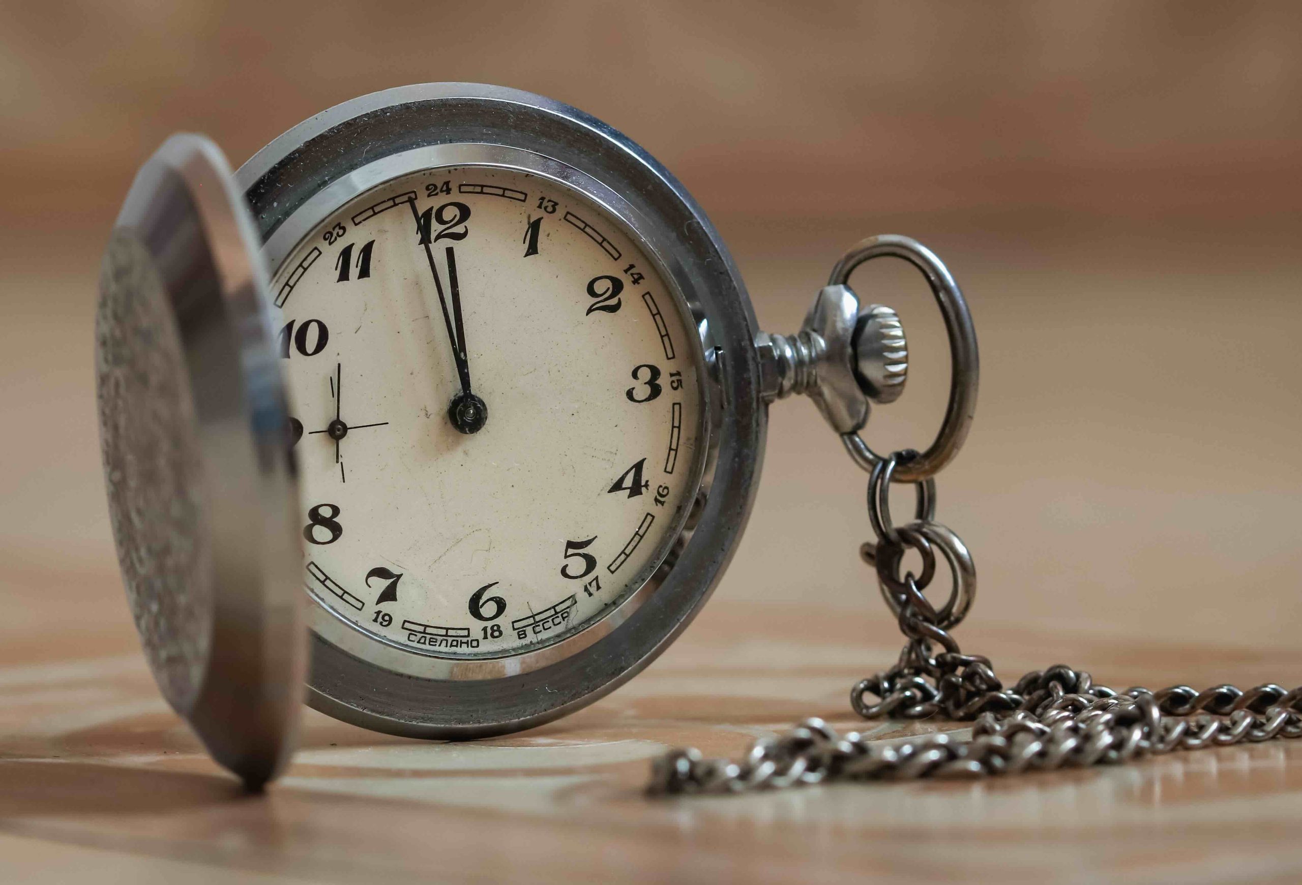 A photo of a pocket watch representing time efficiency for a dumpster rental.